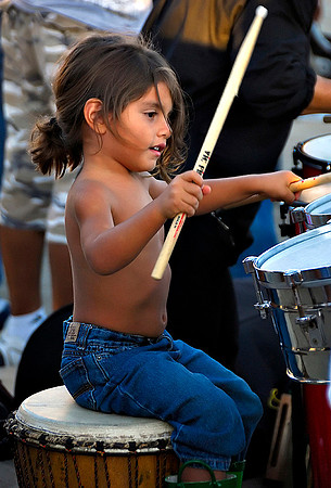 Girl playing at drum circle