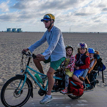 Bike dad on Santa Monica boardwalk