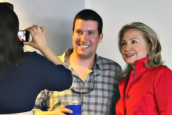 Hilary Clinton poses for photo