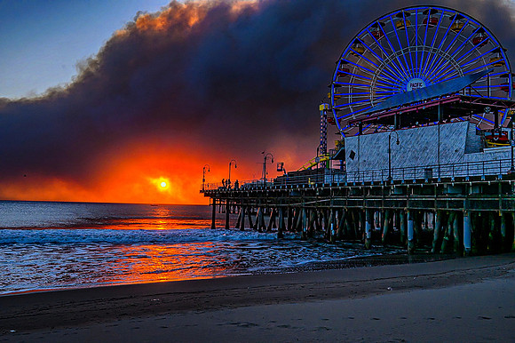 Santa Monica Pier at sunset with Palisades fire smoke 1/8/25